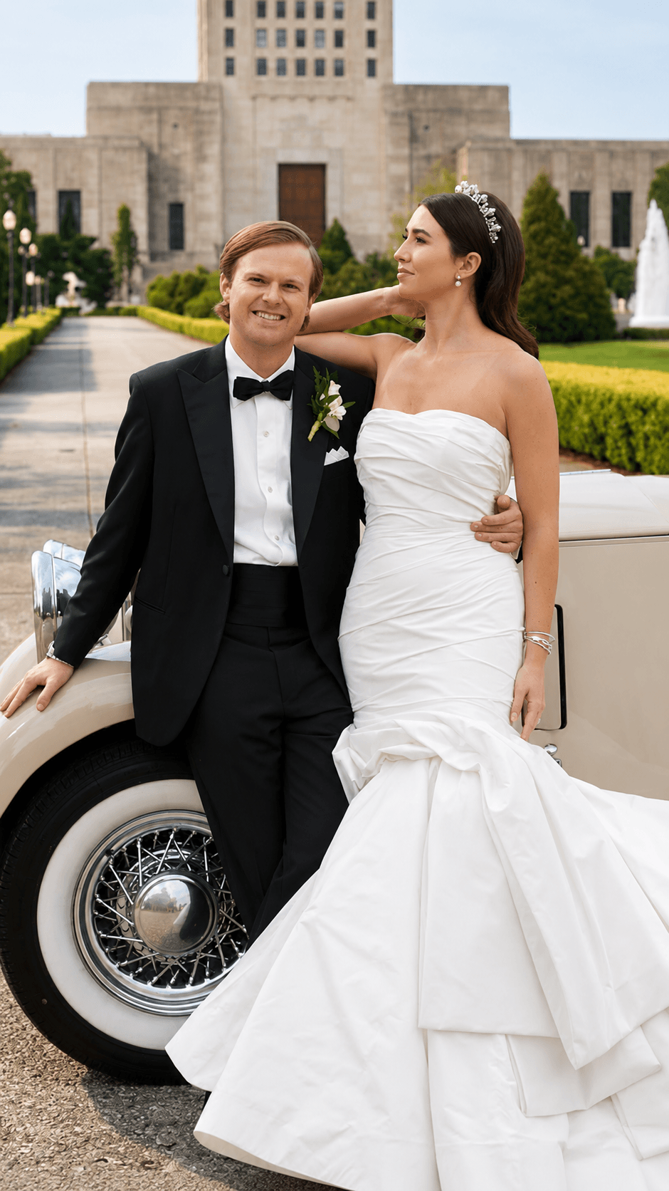Wedding couple beside a vintage car at an estate venue